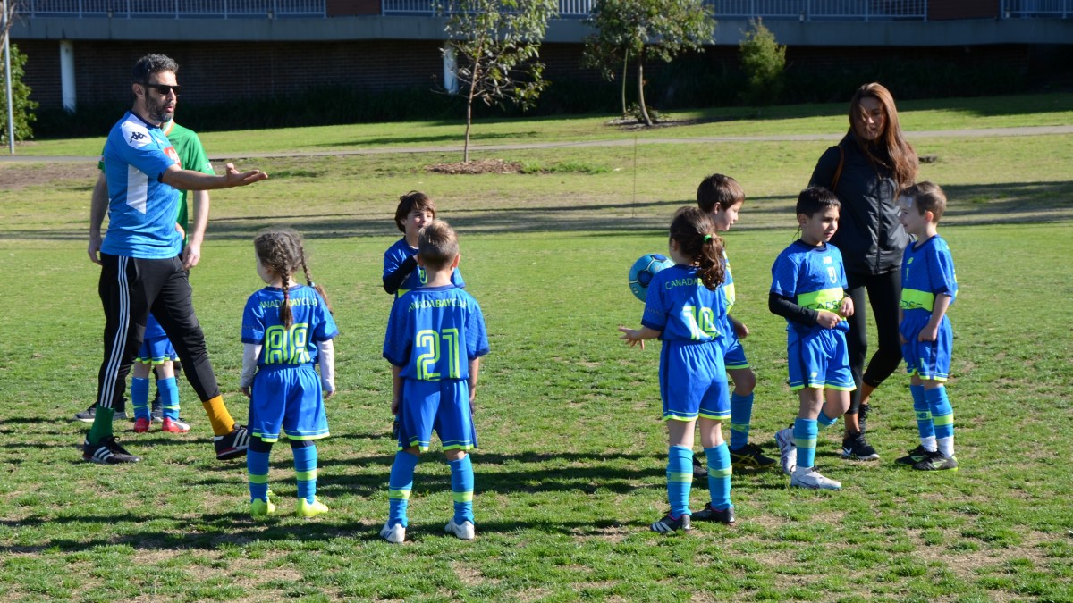 AJFC trained coaches teach kids how to play